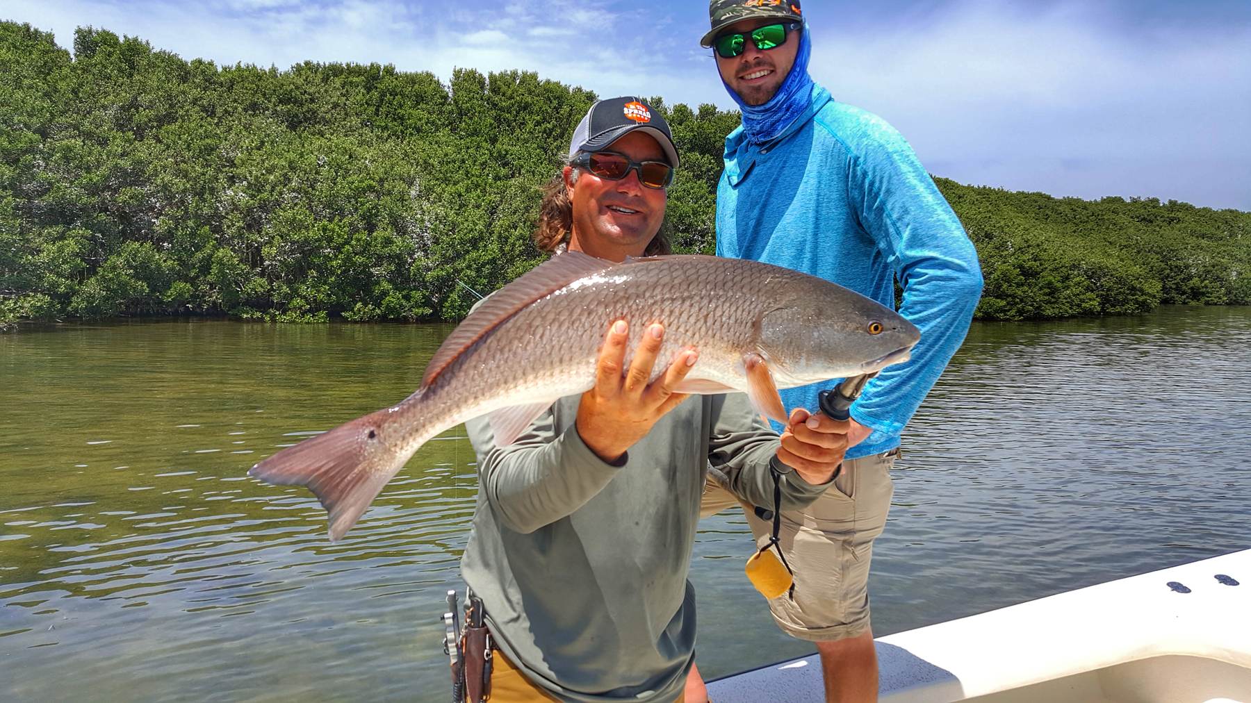 Captain William Toney holding a big redfish on the flats near Homosassa, Florida