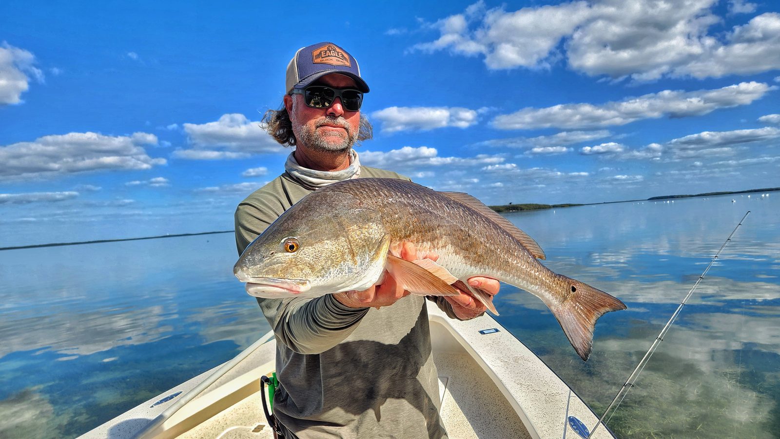 William Toney holding a big redfish caught in Homosassa during an inshore fishing trip.